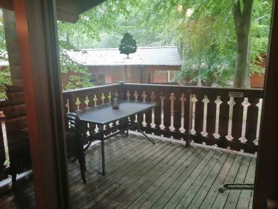 Veranda with table, chairs and hot tub